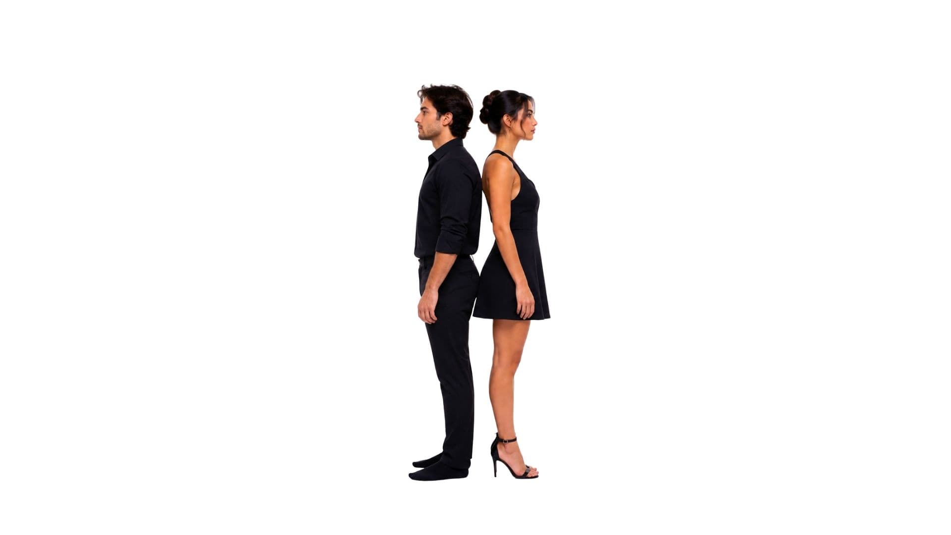 man standing back to back with a woman in heels, shorter by three inches